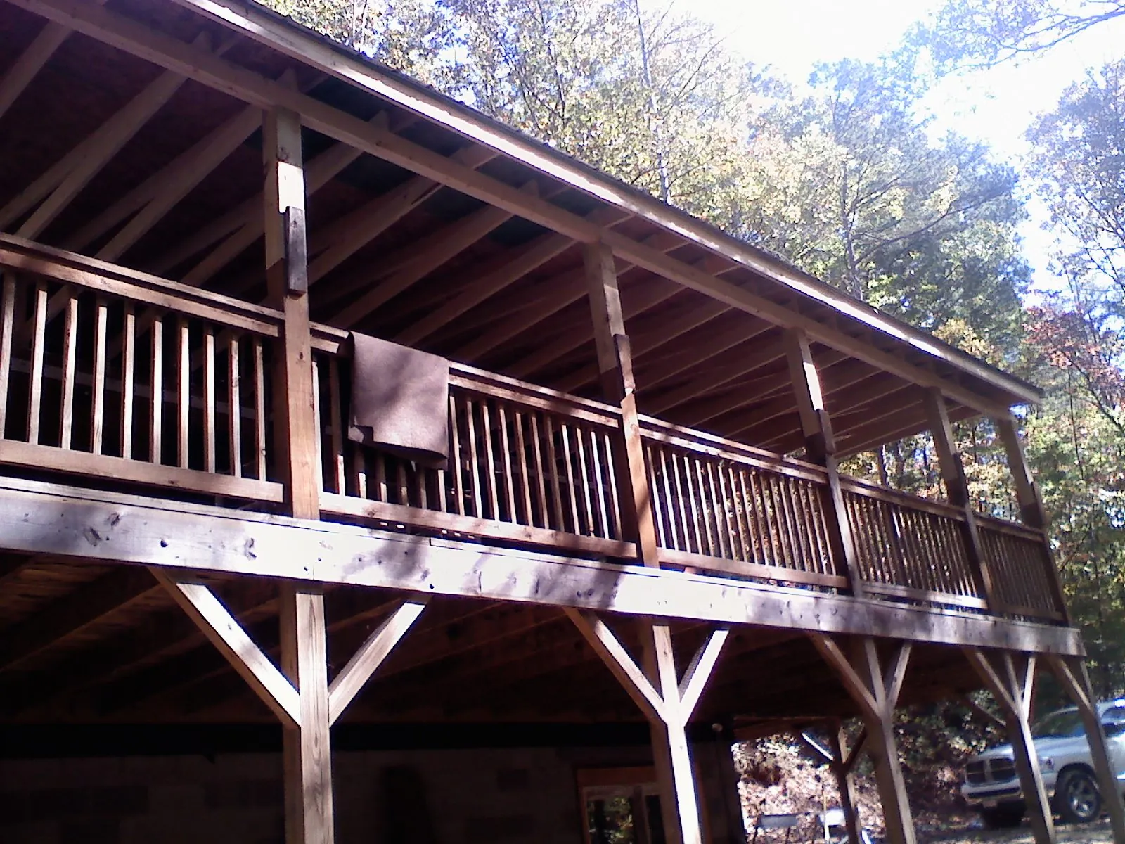 Timber framing under a new elevated porch and deck — Roof Leak Repair in New Auburn by Roofing Brothers